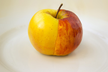 Delicious and fresh apple on white plate