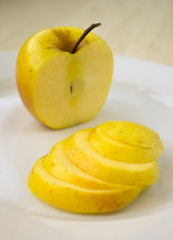 Delicious and fresh apple on white plate