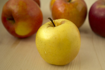 Delicious and fresh apple on wood background