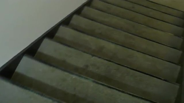 POV view of walking down the emergency stairs in an office highrise building