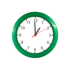 One o'clock on big wall clock in green case isolated on white closeup