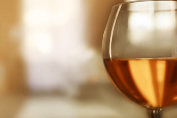 Glass of wine on blurred background