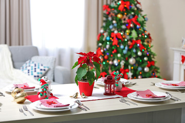 Christmas table setting on light room background