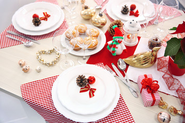 Christmas table setting with holiday decorations