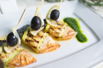 Fish dish with vegetables and olives