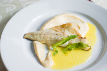 dietary dish of white fish in sauce