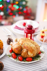 Backed chicken on a Christmas table setting