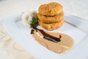 dessert sauce with ice cream and pastries