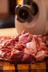 The electric meat grinder and the cut meat