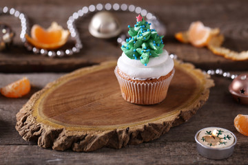 Christmas cupcake on wooden stand