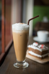 cake on the wood desk in coffee shop