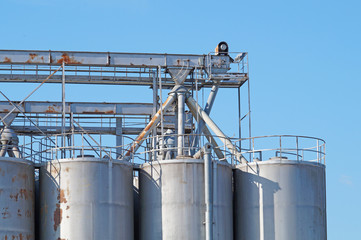 industrial silo with blue sky background