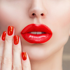 Naklejka premium Red Sexy Lips and Nails closeup. Open Mouth. Manicure and Makeup. Make up concept. Kiss .