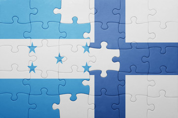 puzzle with the national flag of honduras and finland