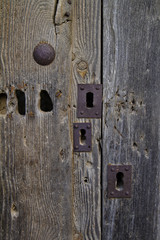 OLD DOOR WITH RUSTY LOCKS