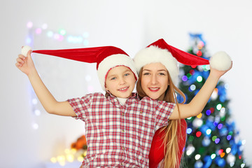 Portrait of girl and boy in decorated Christmas room