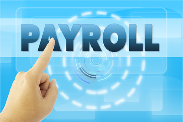 touching PAYROLL sign on blue screen