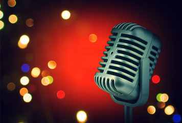 Fototapeta na wymiar Retro microphone with stage lights