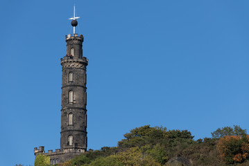 Fototapeta premium Nelsons Monument on Carlton Hill in Edinburgh Scotland. The Ball is right at the top of its travel so it is just before 1PM.