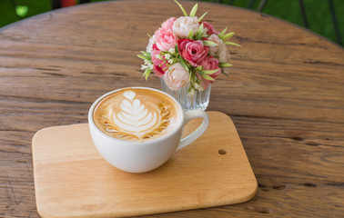 Close up cup of Coffee, latte on the wooden table