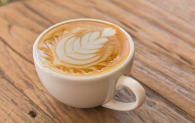 Close up cup of Coffee, latte on the wooden table