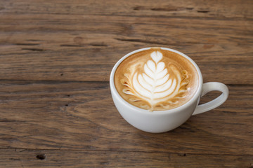 Close up cup of Coffee, latte on the wooden table