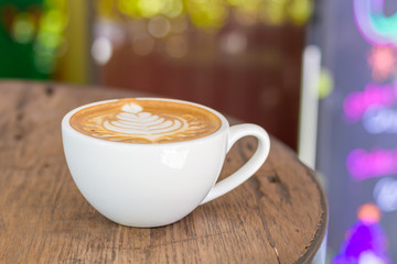 Close up cup of Coffee, latte on the wooden table