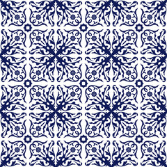 Seamless background image of vintage blue spiral flower vine kaleidoscope pattern.
