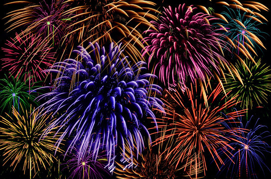 Colorful firework celebration on dark background.