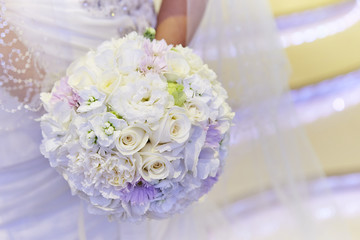 Bride holding a flower bouquet