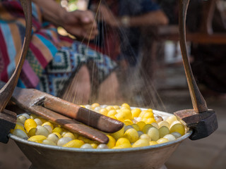 Draw the silk from cocoons