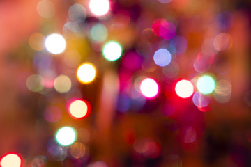 Light in motion by a Christmas tree