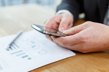 businessman checking financial reports