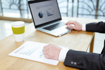 businessman checking financial reports