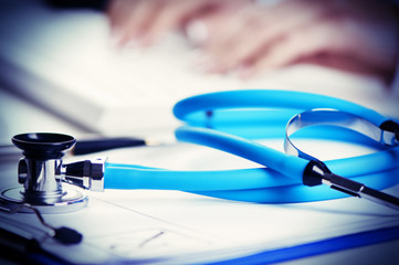 doctor taping on a computer keyboard 