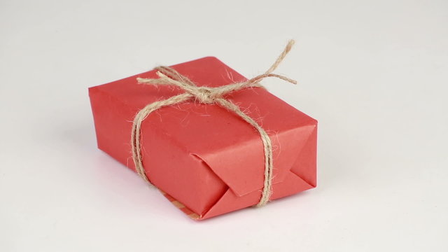 Gift box covered with red wrapping paper