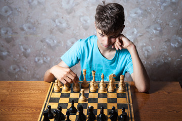 Teenager playing chess