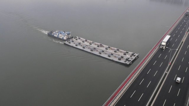 Aerial view on huge tanker ship moving on the river Danube.
