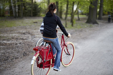 Woman on the bicycle in the park