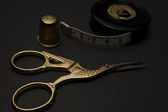 Golden tailoring utensils. High resolution image.
