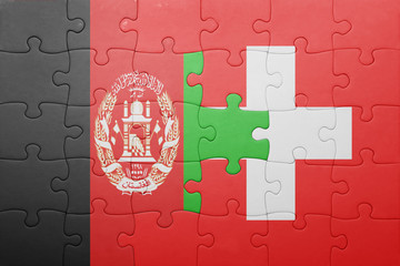puzzle with the national flag of switzerland and afghanistan