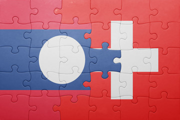 puzzle with the national flag of switzerland and laos