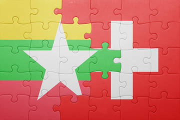 puzzle with the national flag of switzerland and myanmar