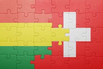 puzzle with the national flag of switzerland and bolivia