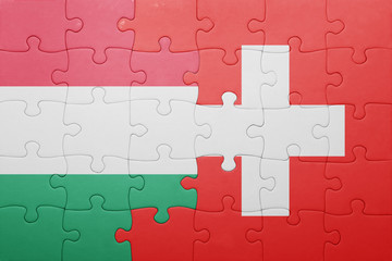 puzzle with the national flag of switzerland and hungary