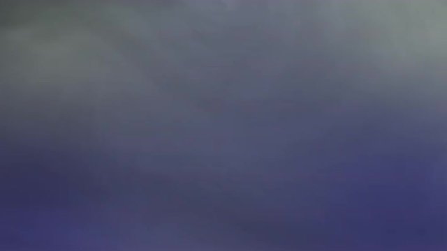 Blue and white fog drifts across the screen.  Recorded against black and intended as a motion graphics background, for compositing with graphics or using a blending mode.  Looping clip.