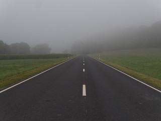 Fototapeta premium Road into fog