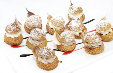 profiteroles with vanilla ice cream decorated with chocolate mint