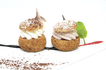 profiteroles with vanilla ice cream decorated with chocolate mint