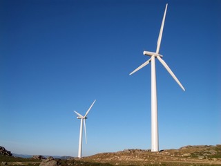 Eolic power generator, windmills over the blue sky